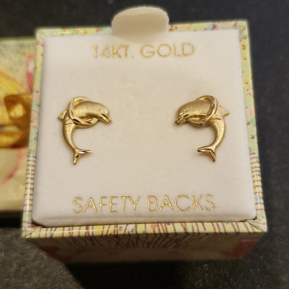 Baby Gold dolphin earrings.
